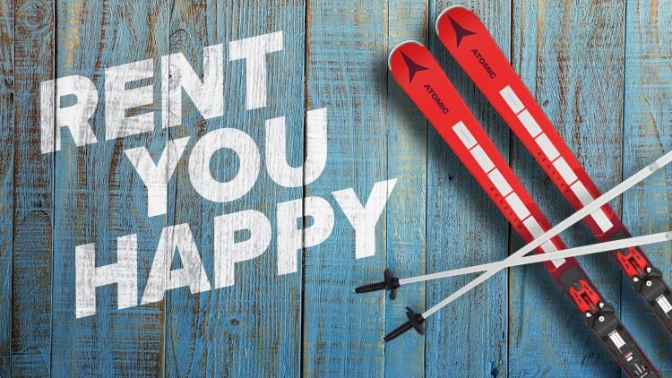 Ein Paar rote Skier mit schwarz-weißen Bindungen, die am unteren Ende gekreuzt sind, auf einem blauen Holzhintergrund platziert. Auf der linken Seite des Bildes steht in großen weißen Buchstaben 'RENT YOU HAPPY'.