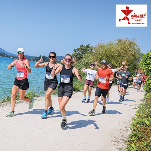 Kärnten läuft 2025. Fröhliche Menschen laufen an einem See entlang.